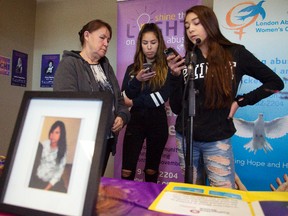 Donna McLeod with her granddaughters, Brandy and Cheyanne, at the launch of Shine the Light on Woman Abuse. (MIKE HENSEN, The London Free Press)