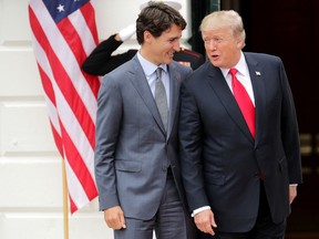 U.S. President Donald Trump (R) and Canadian Prime Minister Justin Trudeau pose for photographs after Trudeau's arrival at the White House October 11, 2017 in Washington, DC. The United States, Canada and Mexico are currently engaged in renegotiating the 25-year-old North American Free Trade Agreement.  Photo by Chip Somodevilla/Getty Images