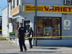 London Police investigate the scene of an overnight assault at the corner of Clarence and Horton Streets in London, Ontario that resulted in a 56-year-old man in hospital in critical condition on Sunday October 22, 2017. (MORRIS LAMONT/THE LONDON FREE PRESS /POSTMEDIA NETWORK)