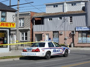 London Police investigate the scene of an overnight assault at the corner of Clarence and Horton Streets in London, Ontario that resulted in a 56-year-old man in hospital in critical condition on Sunday, October 22, 2017. (MORRIS LAMONT, The London Free Press)