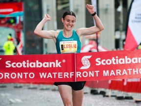 Leslie Sexton of London begins to celebrate as she hits the finish line as the fastest Canadian woman in the Toronto Waterfront Marathon on Sunday, giving her the national title. She was fifth overall in 2:35:45, behind three Ethiopians, including winner Marta Megra in 2:28:17, and a Kenyan. (The Canadian Press)