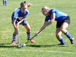 Sarah Skinner (right) of the MDHS Blue Devils battles with this Goderich opponent for control of the ball during Huron-Perth field hockey action Oct. 18 in Mitchell. The locals lost, 5-0. ANDY BADER/MITCHELL ADVOCATE