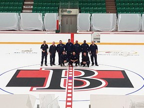 City workers pose at centre ice at Yardmen Arena. (Peter Lyng photo)