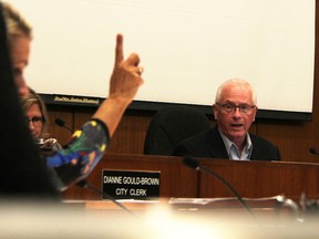 Sarnia City Coun. Mike Kelch acknowledges a question from Coun. Cindy Scholten in council chambers Monday. Kelch chaired the meeting, for which Mayor Mike Bradley was absent. Tyler Kula/Sarnia Observer/Postmedia Network