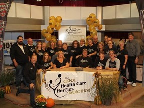 The eight participating hospital foundations, hosts, and volunteers with the grand total - $321,427.