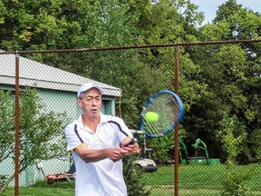 Mike Dawson in action. Dawson entered three categories - singles, men’s doubles and mixed doubles; he won all three categories in the tournament. (Contributed photo)