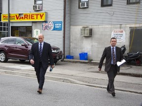 London police detectives were back at Horton Variety at 216 Horton St. Tuesday, investigating a weekend attack that left owner Rajaie El Shorafa in critical condition. (DEREK RUTTAN, The London Free Press)