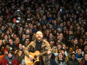 Singalong Collective "Choir Choir Choir!" performs Tragically Hip songs to Hip fans gathered in Toronto's Nathan Phillips Square to pay tribute to the band's late singer Gord Downie, on Tuesday October 24 , 2017. THE CANADIAN PRESS/Chris Young