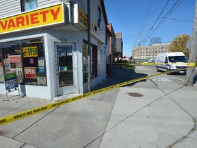 London Police investigate the scene of an assault at the corner of Clarence and Horton Streets in London. (MORRIS LAMONT, The London Free Press)