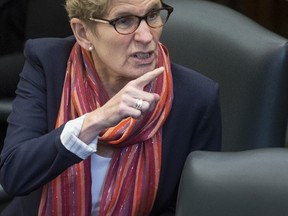 Premier Kathleen Wynne defends her government in the Legislature regarding the Ontario Auditors General special report on the Fair Hydro Plan in Toronto on Oct. 17.