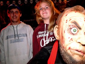 Bailey Paul (left) and Samantha Cassidy help prepare the McCarey Haunted Back Yard for opening night on Wednesday, Oct. 25th, 7-9 p.m. at No. 6 3rd Concession Road (between Mall Road and Simcoe Street near the Norfolk Mall). Admission is a donation to the food bank. (Chris Abbott/Tillsonburg News)