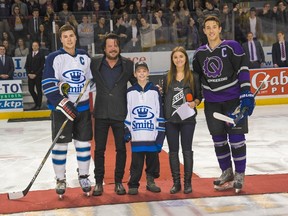 Submitted photo
From left, Commerce team captain Austin Walker, Paul Langlois of The Tragically Hip, brain cancer patient Tyler McDonald, Cure Cancer Classic co-chair Katarina Ignjatic, and Engineering team captain Fred Scott at the puck drop ceremony at the Cure Cancer Classic game in January at the Rogers K-Rock Centre. The January game and a November tournament are fundraisers for the Gord Downie Fund for Brain Cancer Research.