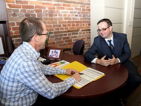 Dave Migneault, left, manager of human resources & organization development speaks with Dylan Stewart, who spent a day at the City of Kingston offices in the British Whig building on Wednesday as part of Disabilities Mentoring Day.  (Ian MacAlpine /The Whig-Standard)