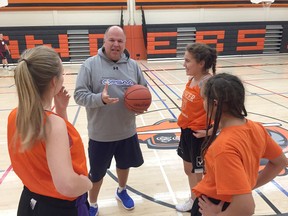 Denis Gauthier, who currently coaches the Sr. Girls’ Basketball team at Lasalle Secondary School, has been honoured provincially for his longtime contribution to athletics. The team includes, clockwise, Sheila Esquib, Dakota Lische-Parkes and Laura Fratin.