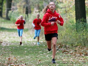 Dylann Rannie of Grand Bend Public School leads the 11-year-old girls' race at the Lambton Kent Elementary School Athletic Association district cross-country meet at Canatara Park in Sarnia, Ont., on Wednesday, Oct. 25, 2017. Rannie won the 2.3-km race in 8:34.9. The meet was for public elementary schools from Lambton County and Chatham-Kent. (MARK MALONE/Postmedia Network)