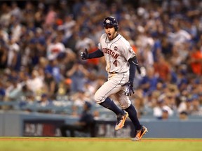 George Springer #4 of the Houston Astros celebrates after hitting a two-run home run during the eleventh inning against the Los Angeles Dodgers in game two of the 2017 World Series at Dodger Stadium on October 25, 2017 in Los Angeles, California. (Photo by Christian Petersen/Getty Images)