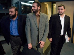 Abdullah Almalki, right to left, Muayyed Nureddin and Ahmad El-Maati arrive at a news conference in Ottawa Tuesday Oct.21, 2008. Three Canadians who were tortured in Syria have received a total of $31 million in federal compensation. THE CANADIAN PRESS/Adrian Wyld