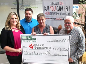 The new Chatham-Kent animal shelter has received a $100,000 donation from The Ridge Landfill Community Trust. Julie MacDonald (left), a community member of the trust, and Wes Belanger and Cathy Smith, with Waste Connections of Canada, present a cheque to Friends of the new Animal Shelter committee co-chair Art Stirling.
