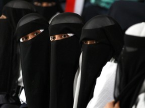 MOHAMMED HUWAIS/Getty Images
A photo taken on Oct. 7, 2013, shows 10-to-15-year-old Yemeni girls sitting at their school in the capital Sanaa. Child brides, or “death brides” as they are sometimes called, are quite common in poor tribal Yemen, where barely pubescent girls are forced into marriage, often to much older men.