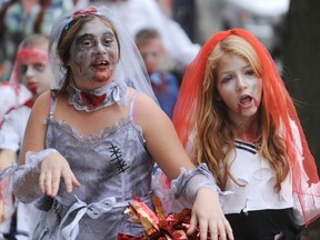 Twelve-year-olds Ashley Symington, left, and Emily Manu participate in the Zombiefest zombie walk in Sarnia in 2012. This year's event also includes elements of multimedia convention Hadoucon. (Observer file photo)