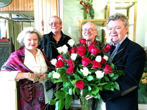 The Blaney siblings, from left, Marilyn, Greg, Paul and Peter are seen inside the family-run business, Blaney's Florists, on Thursday. The flower shop at the corner of Montreal Street and Raglan Road will close for good on Oct. 31, after 41 years in business. (Mike Norris/The Whig-Standard)