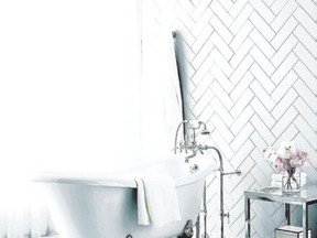 For a bold bathroom, try wallpaper with a lime green background and blue butterflies or go the other way and tile the space with white subway tiles in a herringbone pattern.