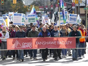 Striking Fanshawe College faculty and supporters march up Richmond Street to London North Centre MPP Deb Matthews? constituency office on Thursday. But Matthews, the advanced education minister, was scheduled to meet with student leaders at Queen?s Park. (DEREK RUTTAN, The London Free Press)