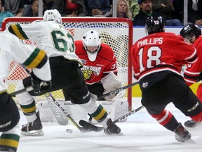 Knights Cliff Pu gets behind the Owen Sound defence but can't get the puck past Owen Sound goaltender Zack Bowman during their game at Budweiser Gardens on Sunday October 15, 2017. (MIKE HENSEN, The London Free Press)