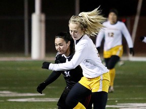 Courtney	Ceccarelli of the Cambrian Golden Shield battles for the ball with Aprilyn Covello of the Seneca Sting during the 2017 belairdirect OCAA Women's Soccer Championship in Sudbury, Ont. on Thursday October 26, 2017. Gino Donato/Sudbury Star/Postmedia Network