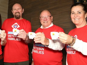 Sudbury Twiggs Coffee Roasters franchise owners Jennifer McElheran, left, and her fiancé, David Russell, Mayor Brian Bigger and Tracy Kerr, representing the Veteran Family Program, take part in the official opening of Twiggs in Sudbury, Ont. on Thursday October 26, 2017. During the celebrations, a partnership between Twiggs and the Veteran Family Program was announced. The program offers services and support to veterans and their families. Mayor Bigger read a proclamation declaring Oct. 26, 2017, as Veteran Family Day. John Lappa/Sudbury Star/Postmedia Network