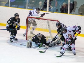 Sarnia Legionnaires scoring ace Alec DeKoning (No. 22 in white) tries a backhand shot during furious action around the LaSalle Vipers net Thursday. DeKoning had a goal and an assist but Sarnia lost the Jr. 'B' hockey contest despite his efforts. (Submitted photo by Shawna Lavoie)