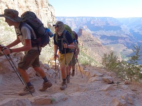 In this July 27, 2015, file photo, a long line of hikers head out of the Grand Canyon along the Bright Angel Trail at Grand Canyon National Park, Ariz. Travel writer Bob Boughner suggests Canadians might want to consider northern Arizona as a winter destination rather than hurricane-ravaged Florida. (Ross D. Franklin/Associated Press)