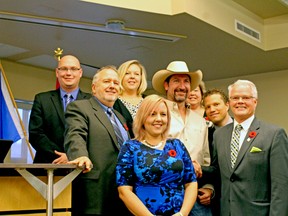 Members of the new Spruce Grove council pose with country singer Steve Newsome following their inaugural meeting on Oct. 23. Council quickly adopted a change of elected official titles from alderman to councillor. - Photo by Keenan Sorokan