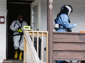 The North Bay Police Service's forensic unit and a forensic engineer with the Office of the Fire Marshal were sifting through the aftermath of a rooming house fire on Algonquin Avenue Friday. Gord Young/The Nugget.
