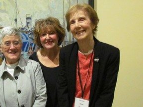 Volunteers, from left, Brenda Bandy, Dianne Moore and Annie Horodyski are show in the main gallery at the Judith and Norman Alix Art Gallery in downtown Sarnia. Bandy and Moore are part of a group of "singing docents" who add in live music during special tours and events at the public art gallery. (Paul Morden/Sarnia Observer/Postmedia Network)