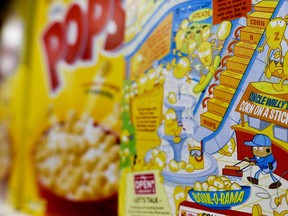 Keith Srakocic/The Associated Press
The reverse side of a box of Kellogg’s Corn Pops cereal, at right, is photographed next to the front of another box on a grocery store shelf in Harmony, Pa. Kellogg’s is redoing its Corn Pops cereal boxes after a complaint that the art on the back is racially insensitive. The box shows cartoon Corn Pops hanging out in a retail mall. Author Saladin Ahmed complained on Twitter that the cereal box is “teaching kids racism” because the only brown Corn Pop depicted is working as a janitor scrubbing the floor.