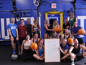 Courtesy of Crossfit Queen Street
Jan Murphy with his CrossFit group members and CrossFit Queen Street co-owner Storm Patterson, far left, following a CrossFit workout on Monday.