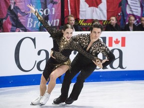 Tessa Virtue of London and Scott Moir of Ilderton perform their short dance at Skate Canada International in Regina on Friday, when they set a world record for points. (The Canadian Press)