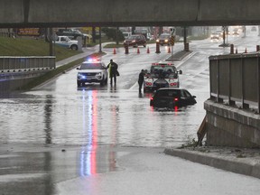 A number of cars got stuck on the Gardiners Road underpass, which flooded after more than 100 millimetres of rain fell in a 12hour period in Kingston, Ont. on Monday July 24, 2017. Julia McKay/The Whig-Standard/Postmedia Network
