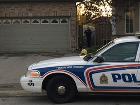 London police hold the scene at 252 Leaksdale Circle in London's southeast end Saturday evening after a 25-year-old man was arrested and charged with second degree murder Friday. (Jennifer Bieman/The London Free Press)