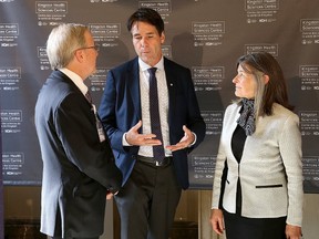 Dr. David Pichora, left, president and CEO of the Kingston Health Sciences Centre, Eric Hoskins, Ontario Minister of Health and Longterm Care, and Kingston and the Islands MPP Sophie Kiwala chat Friday after Hoskins' announcement that the provincial government would invest $570 million in revitalizing Kingston General Hospital. (Ian MacAlpine/The Whig-Standard)