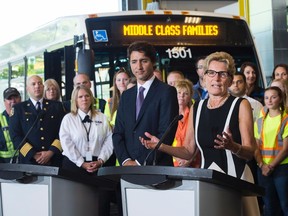 Ontario Premier Kathleen Wynne, right, makes an announcement with Prime Minister Justin Trudeau regarding new funding for transit in Barrie, Ont., on Tuesday, August 23, 2016. THE CANADIAN PRESS/Nathan Denette