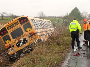 BRUCE BELL/THE INTELLIGENCER
Police report as many as a dozen students were on the north-bound bus when it left Shannon Road in Bloomfield at approximately 3:30 p.m. on Monday afternoon and settled on its side in the west ditch. The students were checked by paramedics at the scene and there were no serious injuries.