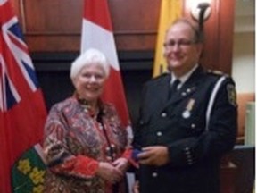 Tony Southwell (right) is presented with his first bar (30 years service) for the Emergency Medical Services Exemplary Service Medal by Lieutenant Governor, The Honourable Elizabeth Dowdeswell. (Contributed photo)