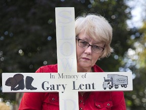 The Ministry of Transportation has denied Kathleen Reed the right to post this cross near the spot on Highway 401 that her partner Gary Lent was killed in a collision in February, because it is considered a possible distraction. Photo shot  in London, Ont. on Thursday October 26, 2017. (DEREK RUTTAN, Postmedia Network)