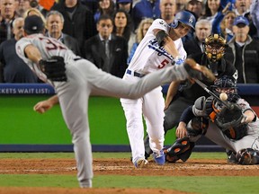 Los Angeles Dodgers' Corey Seager hits a sacrifice fly off Houston Astros starting pitcher Justin Verlander during the sixth inning of Game 6 of baseball's World Series Tuesday, Oct. 31, 2017, in Los Angeles. (AP Photo/Mark J. Terrill)