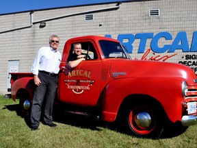 Wilf Meyers (left) and his son, William, at an open house celebrating the 40th anniversary of their local screen printing company, Artcal. CHRIS MONTANINI\LONDONER\POSTMEDIA NETWORK