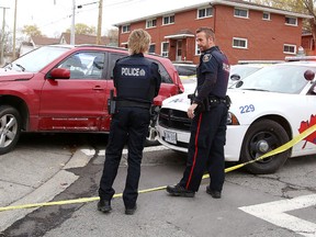 Greater Sudbury Police officers investigate at the corner of Mackenzie and Kathleen street, police were involved in pursuit after reports of vehicle being driven erratically in Sudbury, Ont. on Wednesday November 1, 2017. One person is in custody, the Incident occurred in the down town core. Accused is charged with multiple traffic violations. Any witnesses or people whose vehicle sustained damage are asked to call Police.Gino Donato/Sudbury Star/Postmedia Network