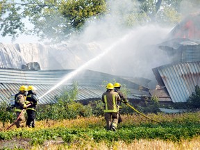 Chatham-Kent firefighters put out a blaze in this file photo from 2013. The municipality is worried that new provincial legislation that overhauls Ontario labour laws could impact the municipality’s bottom line, in regard to providing compensation to volunteer firemen, of which Chatham-Kent has more than 300.