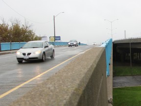 Vehicles and a pedestrian use the Donohue Bridge in Sarnia Thursday Nov. 2, 2017. Complications in repair work this year mean a heftier price tag for construction in 2018, Sarnia's construction manager says. (Tyler Kula/Sarnia Observer)